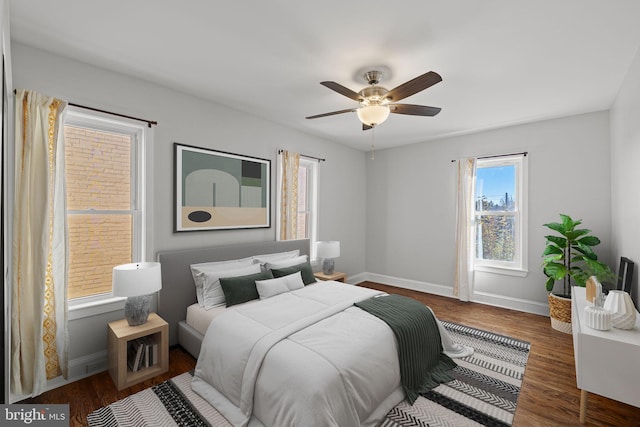 bedroom with dark wood-type flooring and ceiling fan