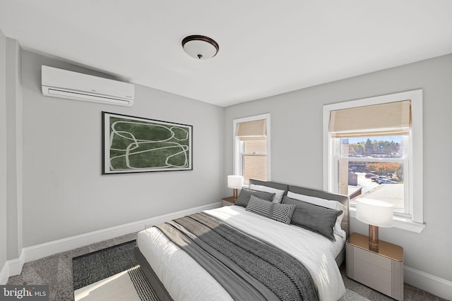 bedroom with carpet flooring and a wall mounted air conditioner