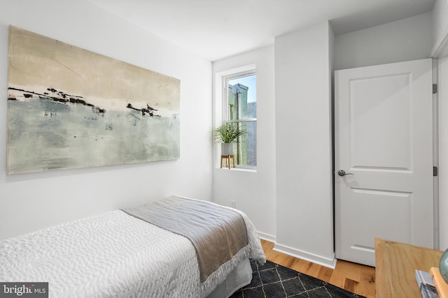 bedroom featuring wood-type flooring