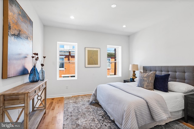 bedroom with hardwood / wood-style floors