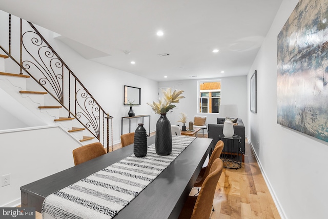 dining space featuring light wood-type flooring