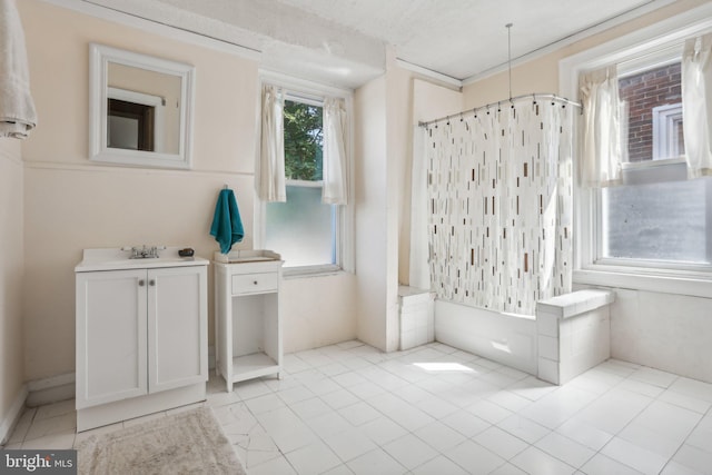 bathroom featuring shower / tub combo with curtain, tile patterned flooring, and vanity