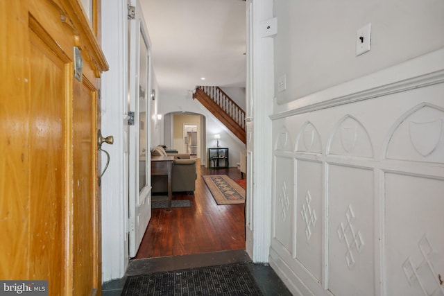 corridor featuring dark hardwood / wood-style floors