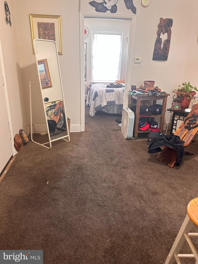 interior space featuring dark colored carpet