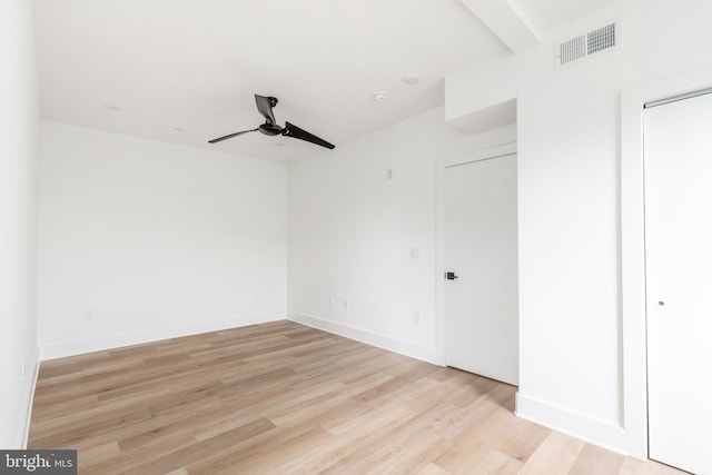 unfurnished bedroom with ceiling fan and light hardwood / wood-style floors