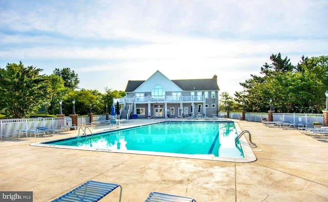 view of pool featuring a patio