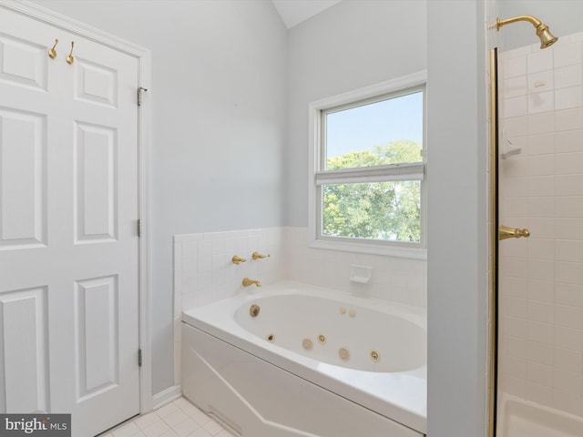 bathroom featuring tile patterned flooring and plus walk in shower