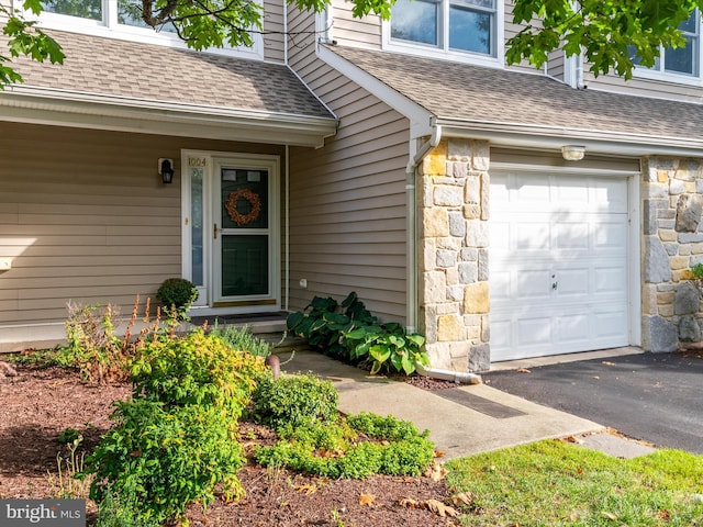 view of exterior entry featuring a garage