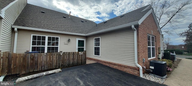 back of property with central AC unit