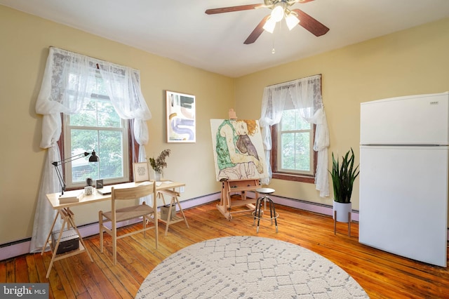 sitting room featuring ceiling fan and wood-type flooring