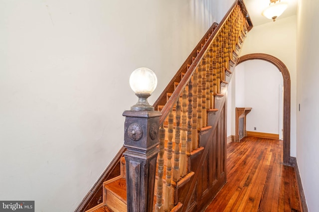 stairway featuring hardwood / wood-style floors