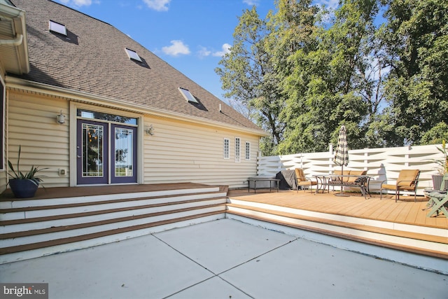 view of patio featuring french doors and a deck