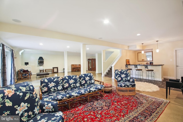 living room featuring concrete flooring