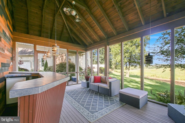 sunroom with wooden ceiling, lofted ceiling with beams, and plenty of natural light