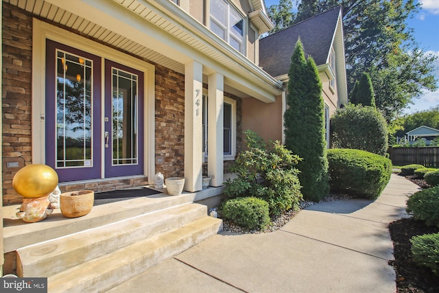 doorway to property featuring a porch