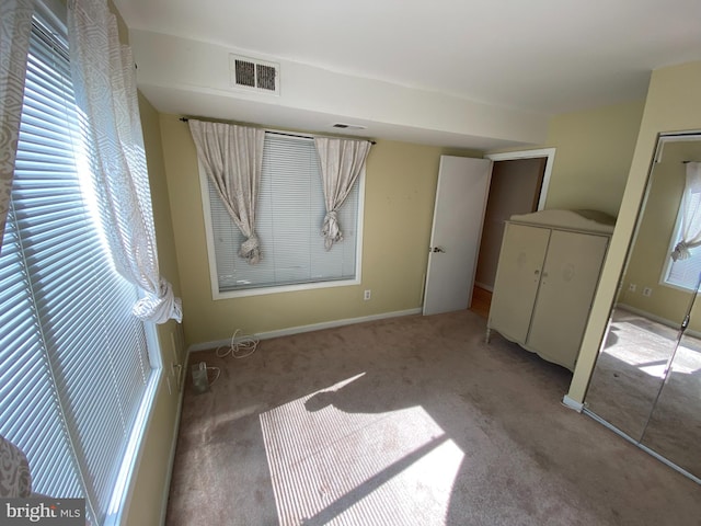 unfurnished bedroom with carpet flooring