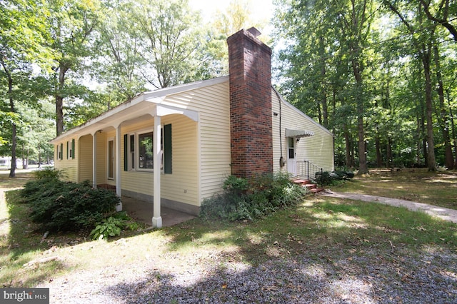 view of property exterior featuring a porch