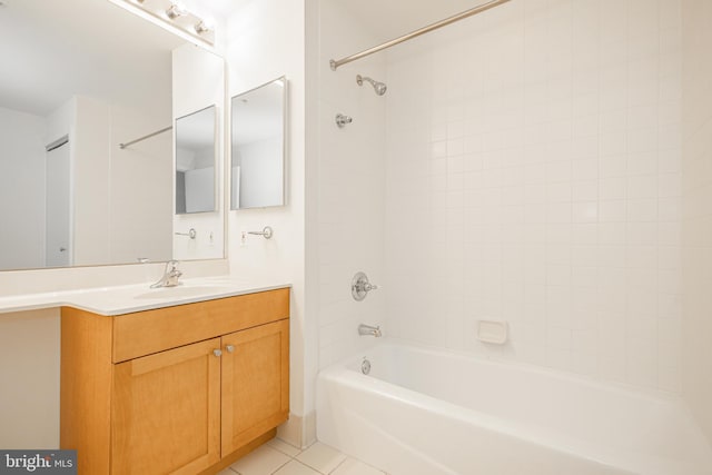 bathroom featuring tile patterned floors, vanity, and  shower combination