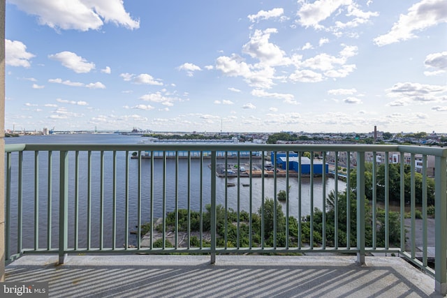 balcony featuring a water view