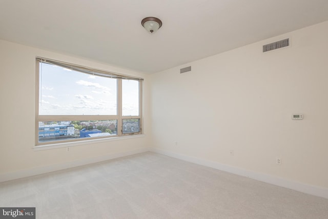 empty room with light colored carpet