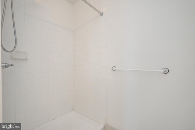 bathroom with tiled shower