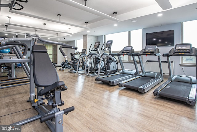 gym featuring light wood-type flooring