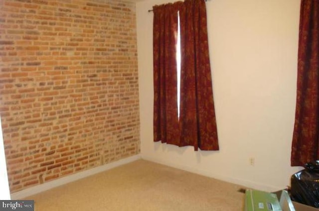 unfurnished room featuring carpet