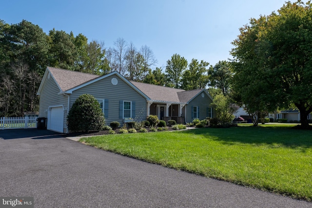 ranch-style home featuring a front lawn