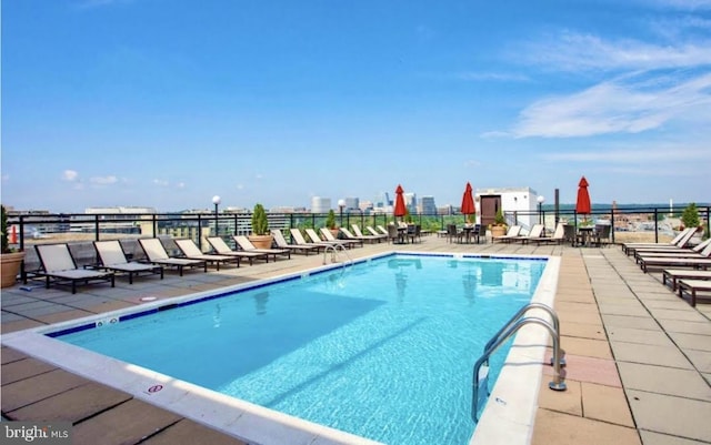 community pool featuring a patio area