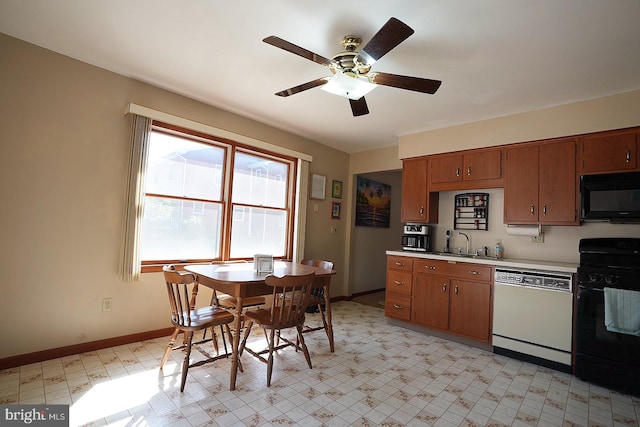 kitchen with black appliances, sink, and ceiling fan