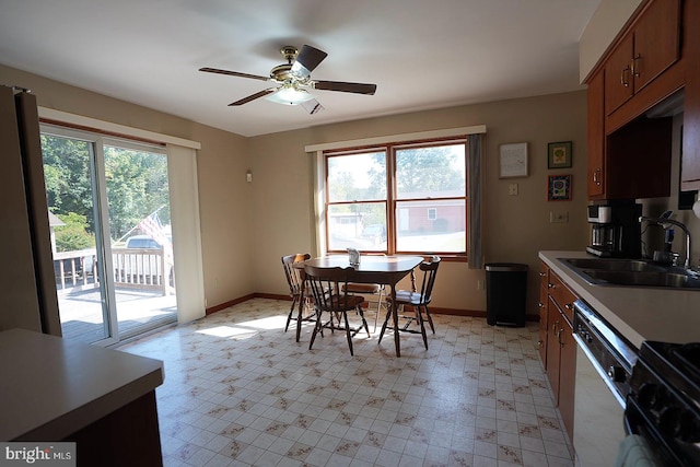 dining room with sink and ceiling fan