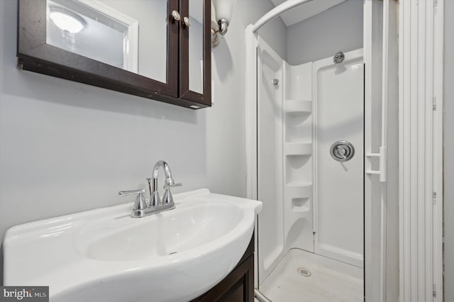 bathroom with vanity and walk in shower