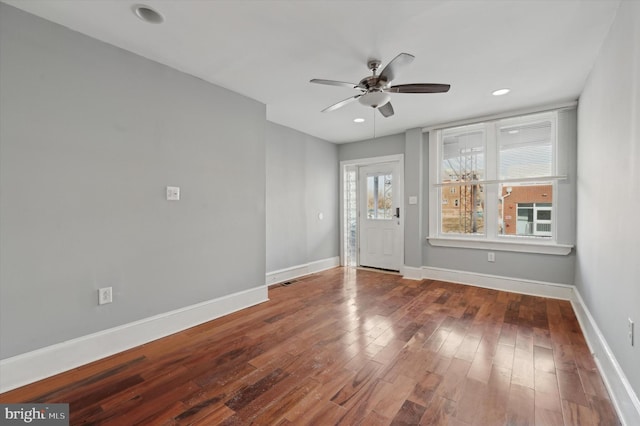 unfurnished room featuring hardwood / wood-style flooring and ceiling fan