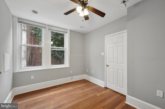 unfurnished room with ceiling fan and light hardwood / wood-style flooring