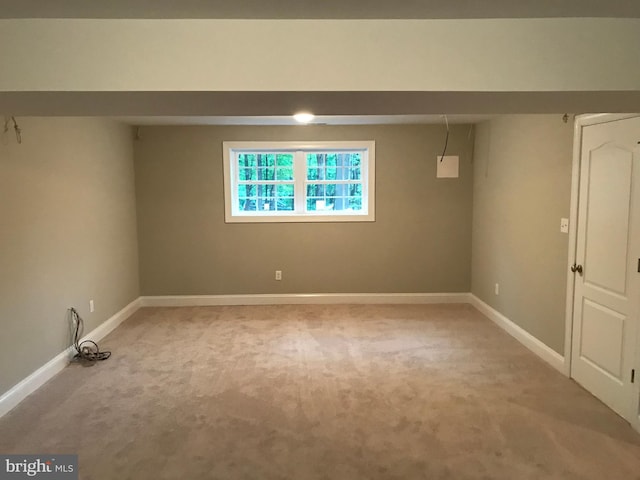 empty room with light carpet and baseboards