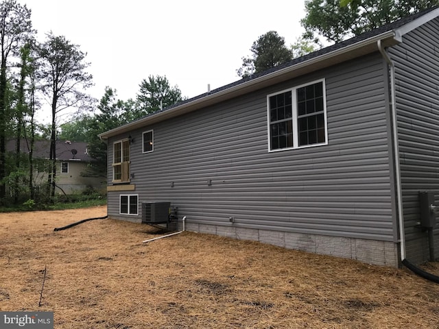 view of home's exterior with central air condition unit