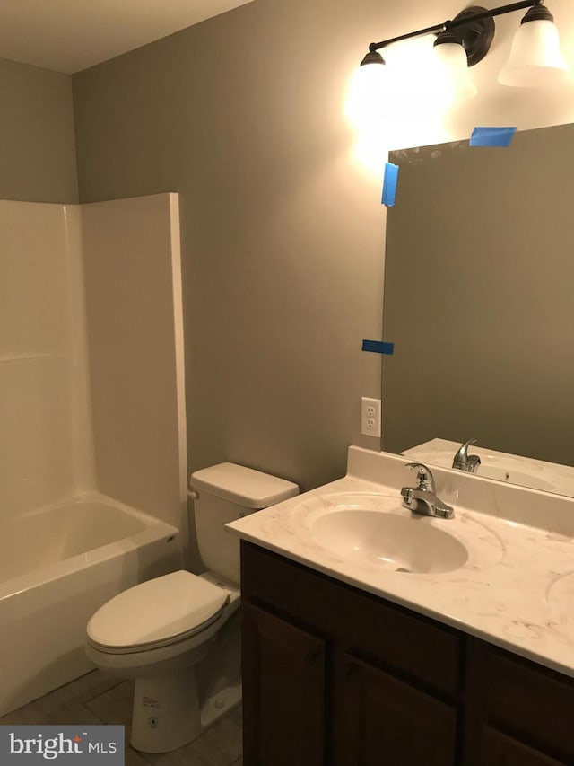 full bath featuring tile patterned flooring, toilet, and vanity