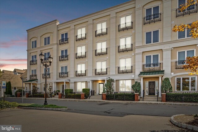 entrance to property with a balcony