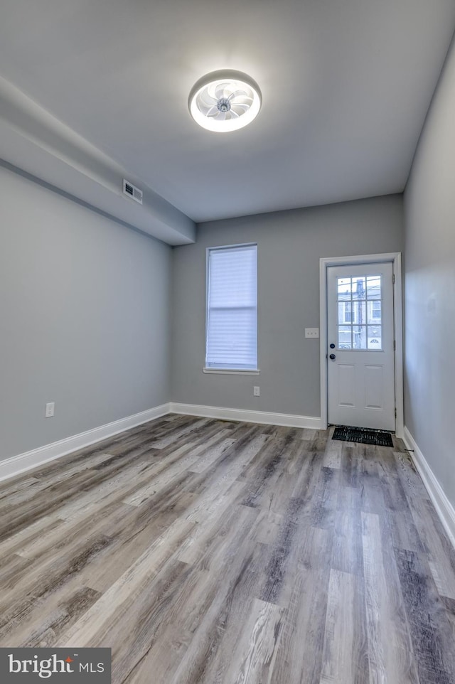 entryway with light hardwood / wood-style flooring