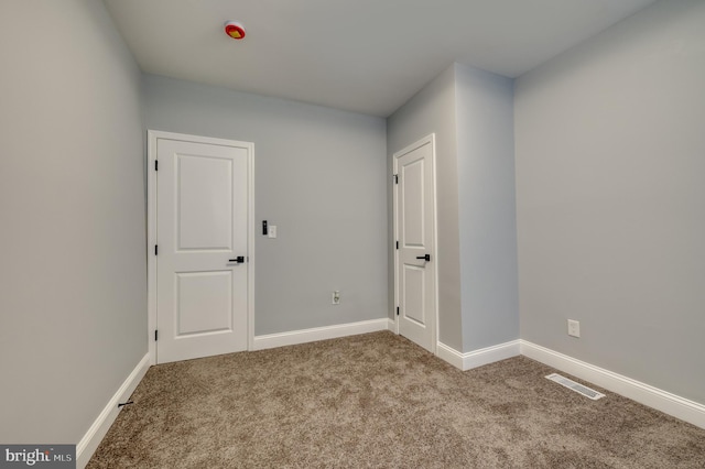 spare room with light carpet