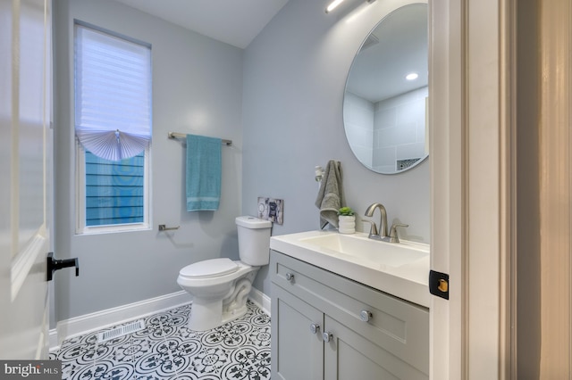 bathroom with tile patterned floors, vanity, and toilet