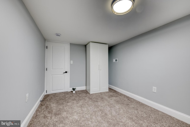 unfurnished bedroom with light carpet