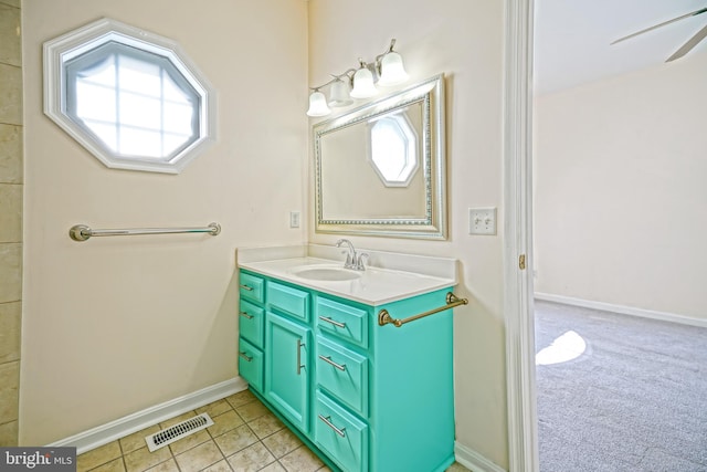 bathroom featuring vanity, ceiling fan, and tile patterned flooring