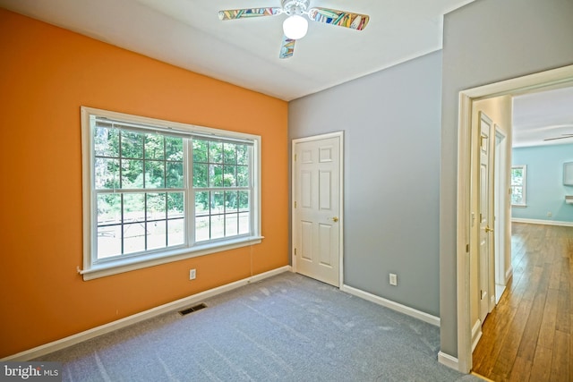 unfurnished bedroom with hardwood / wood-style floors and ceiling fan