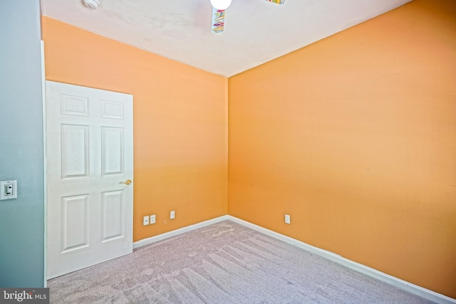 spare room with lofted ceiling, carpet flooring, and ceiling fan