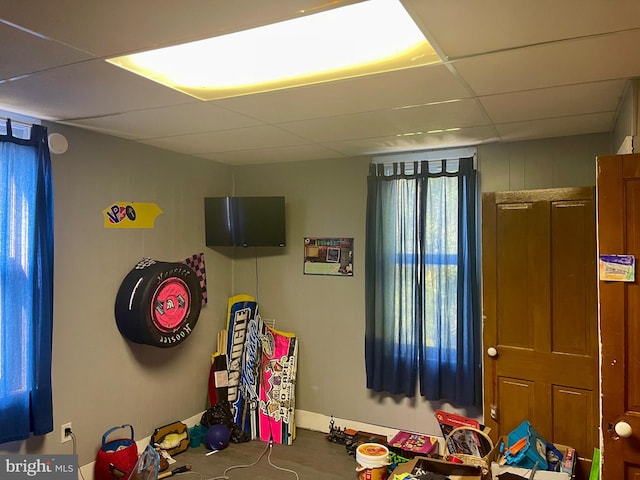 playroom featuring a paneled ceiling