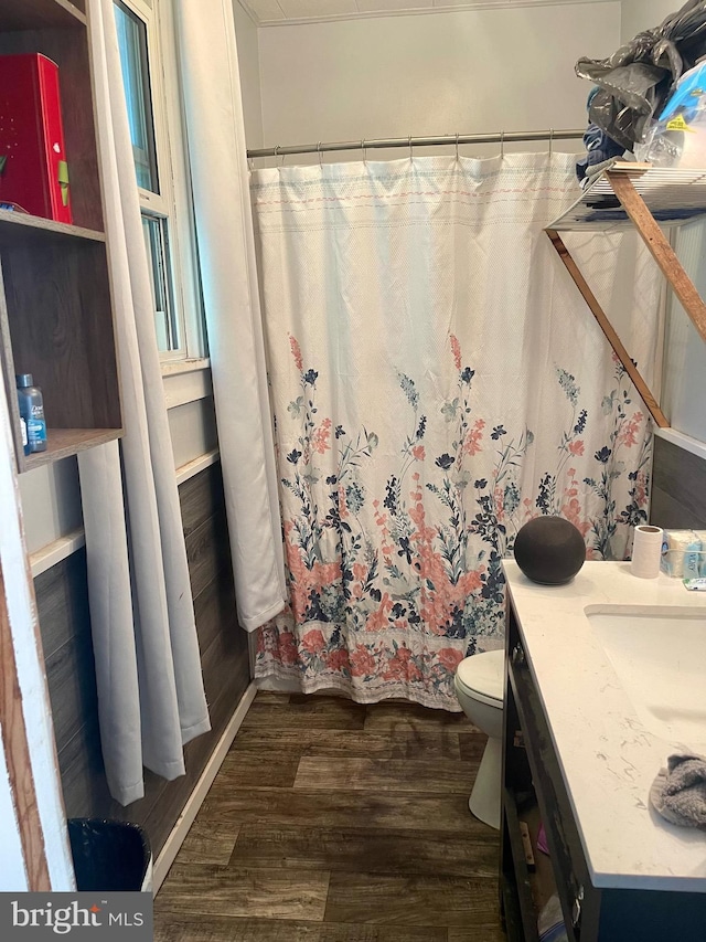 bathroom with vanity, hardwood / wood-style flooring, toilet, and a shower with shower curtain