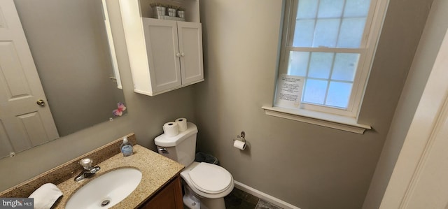 bathroom featuring vanity and toilet