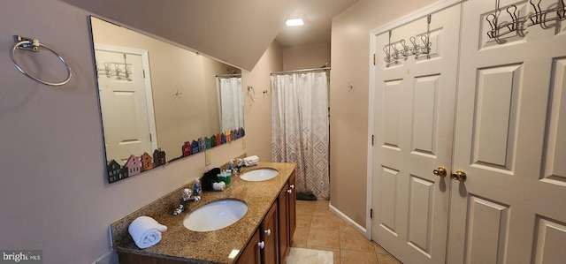 bathroom with tile patterned floors, walk in shower, and vanity