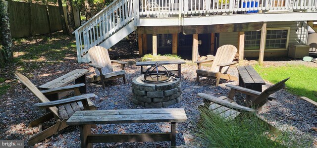 view of patio with a fire pit and a deck